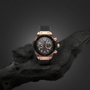 Beautiful gold men's watch with a black strap on a wooden stand, Beautiful gold men's watch with a black strap on a wooden stand,
